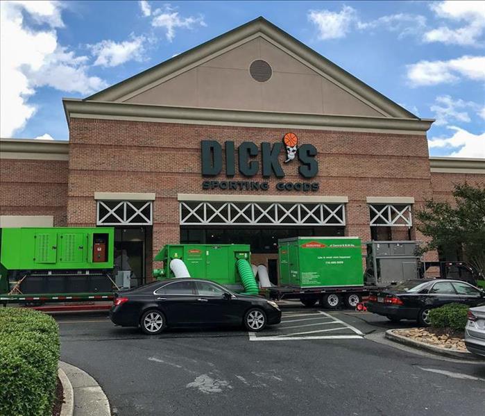 Trucks and commercial dryers in front of a Dick's Sporting Goods in Nashville