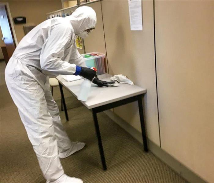 SERVPRO technician wiping down a table in a Nashville office for a cleaning