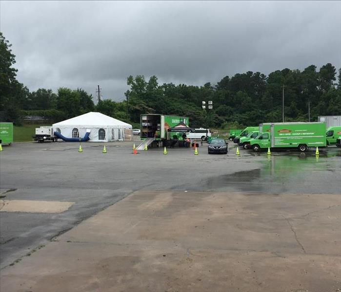 servpro trucks and equipment set up in parking lot