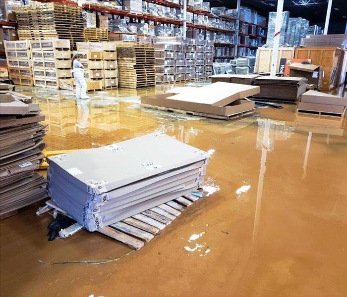 Standing water on the ground of a Nashville, TN warehouse